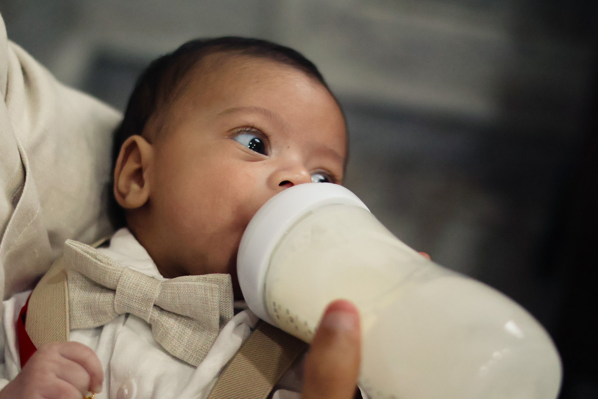 Baby being fed during the christening day