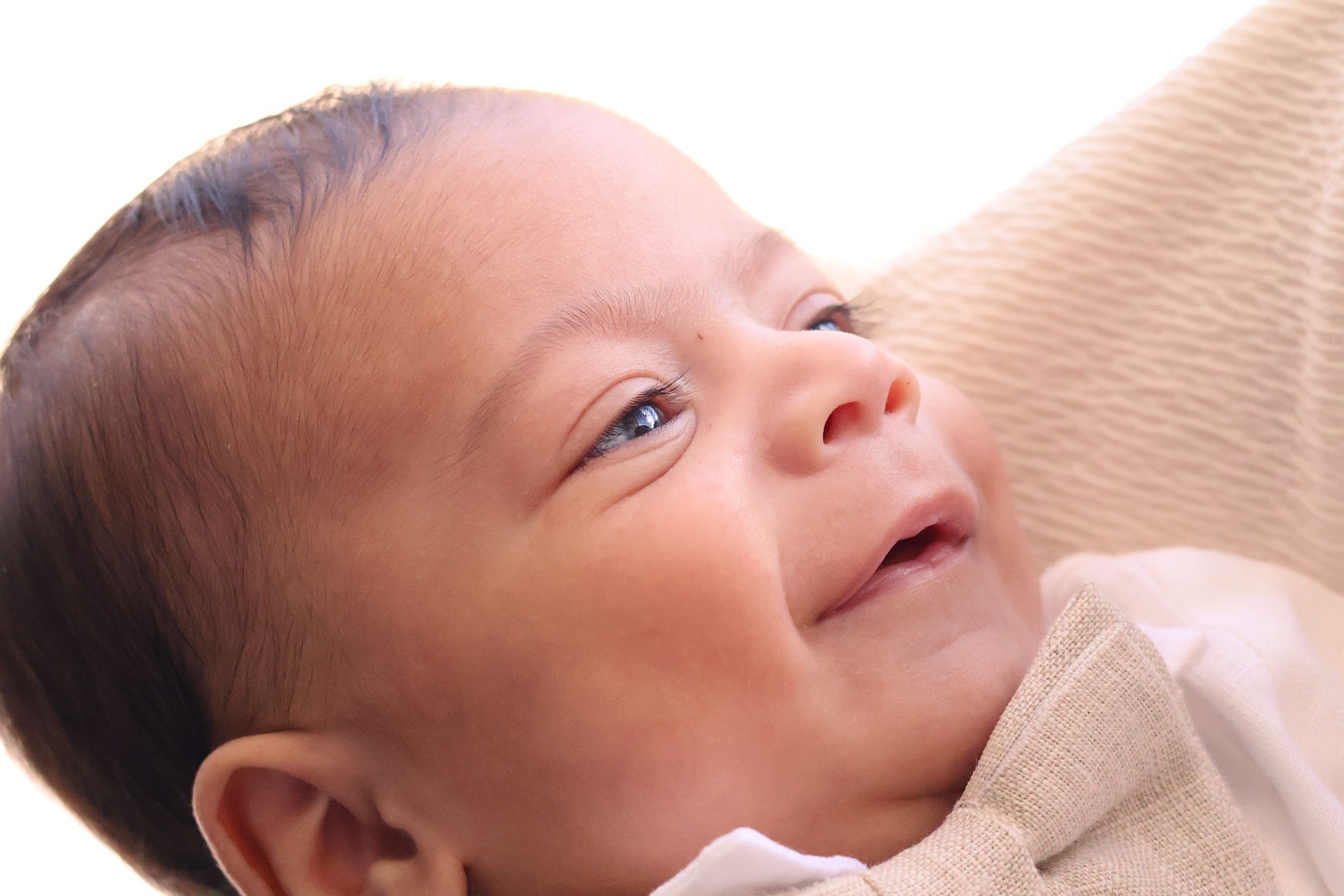 Smiling baby close-up at the end of the christening gallery