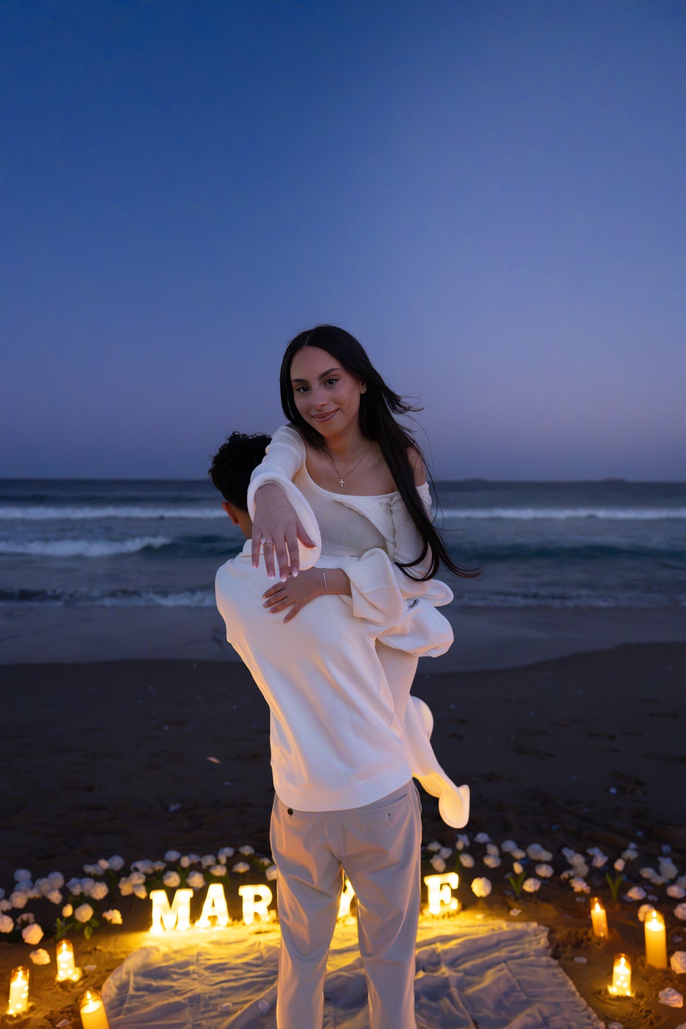 Intimate portrait of the newly engaged couple at night